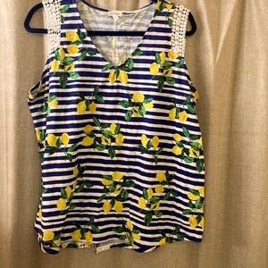 Lemon tank with crochet embellishment.